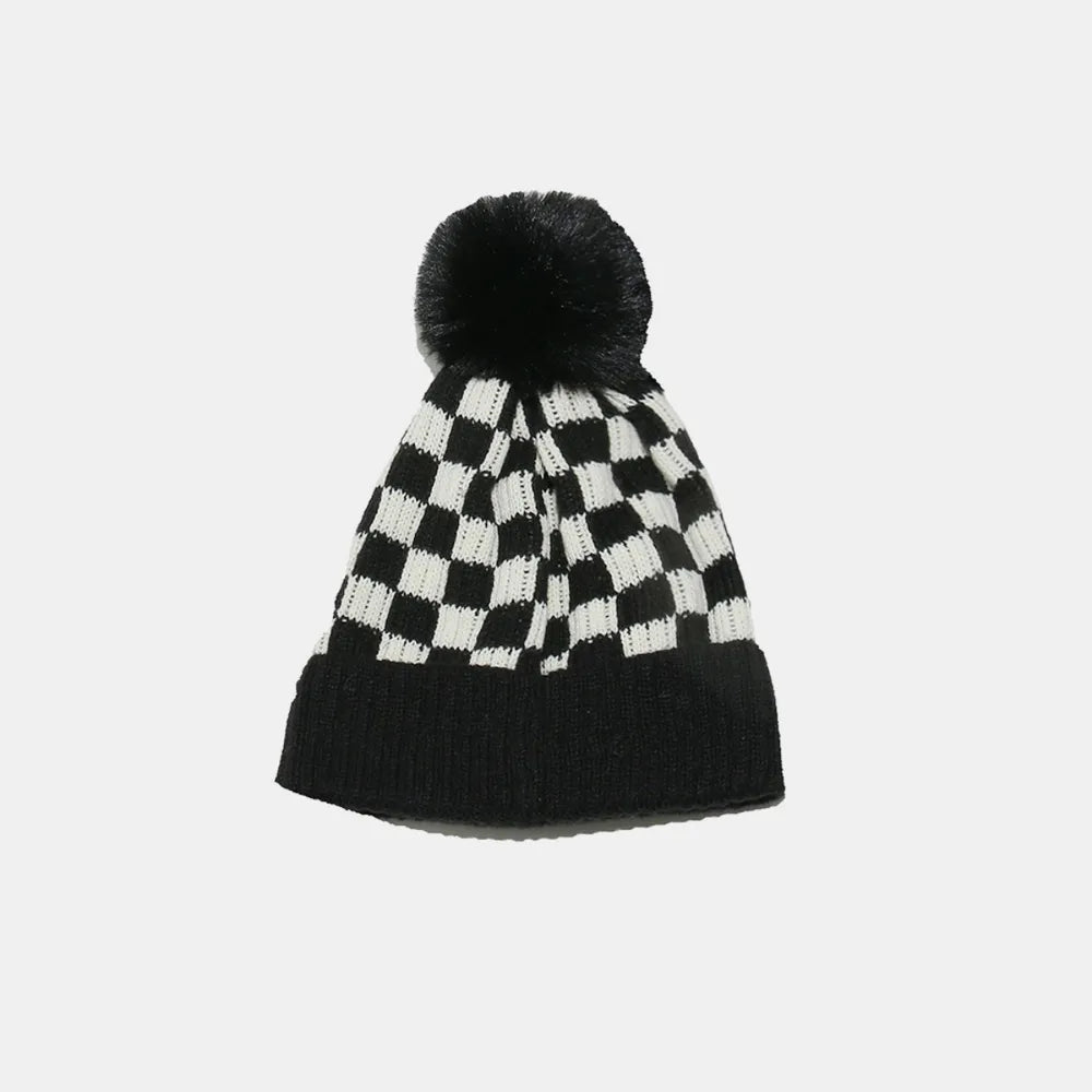 Checkerboard knit beanie with faux fur pompom