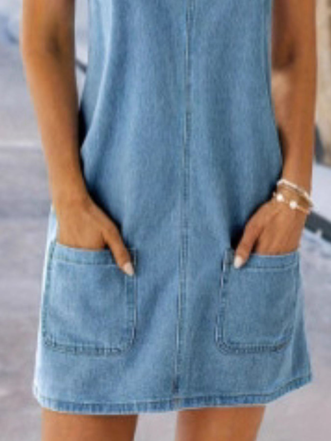 Sleeveless denim overall mini dress with patch pockets
