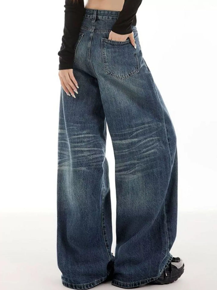 Vintage wash wide-leg jeans with whiskered fade