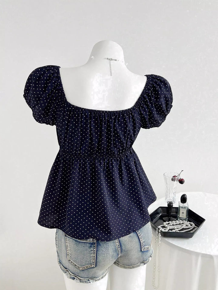 Polka dot scoop-neck peplum blouse with puff sleeves