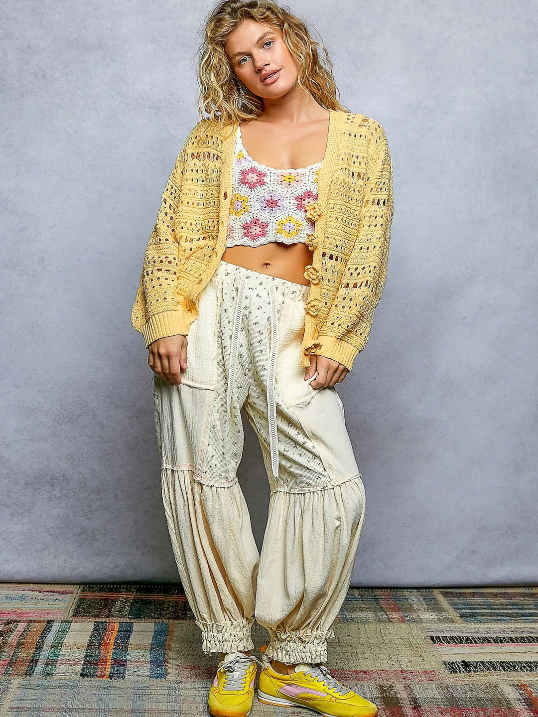 Open-knit V-neck cardigan with 3D floral button closure