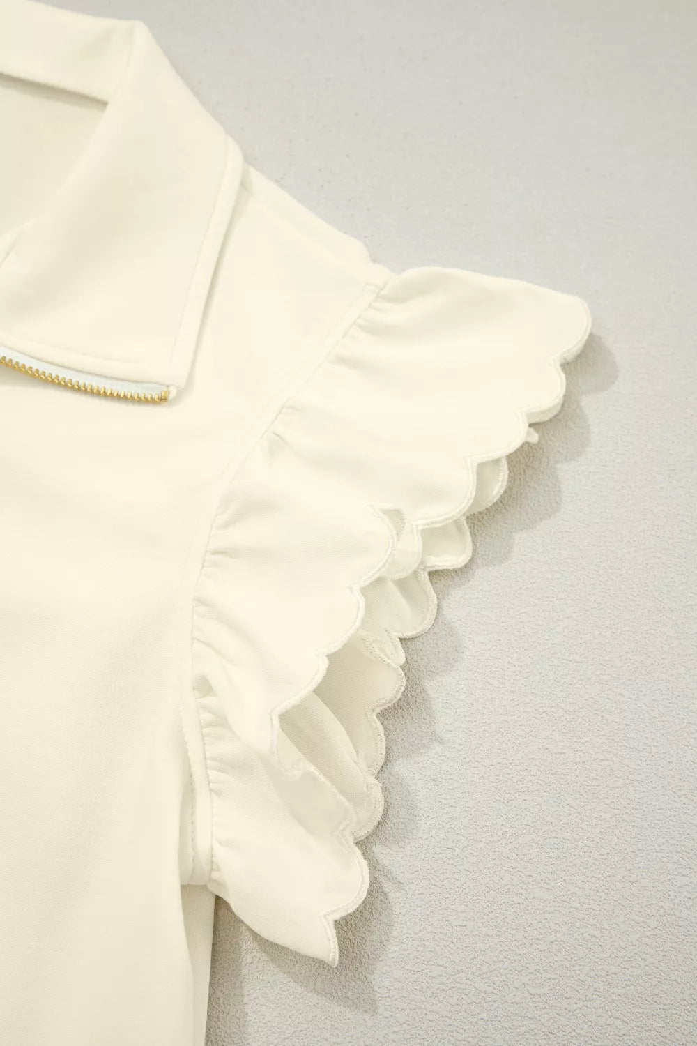 Ruffle cap sleeve half-zip stand collar blouse