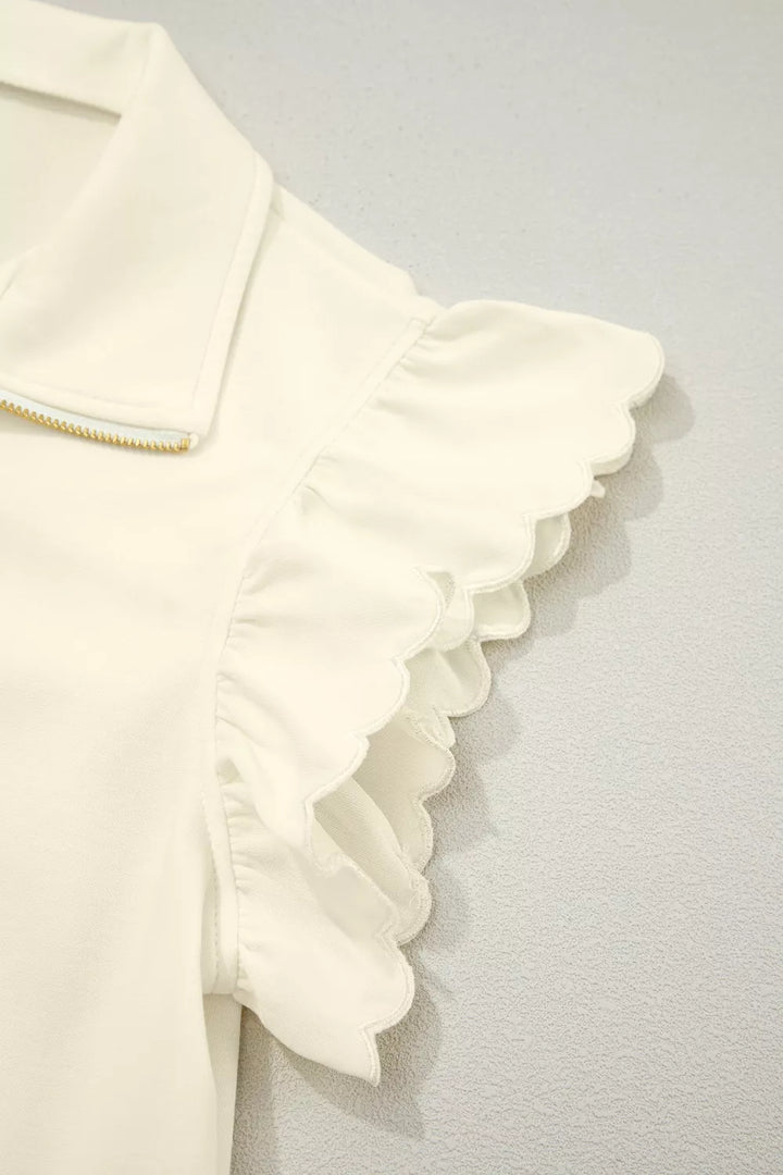 Ruffle cap sleeve half-zip stand collar blouse