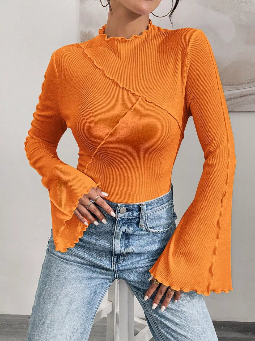 Ribbed knit mock neck top with lettuce-edge flare sleeves