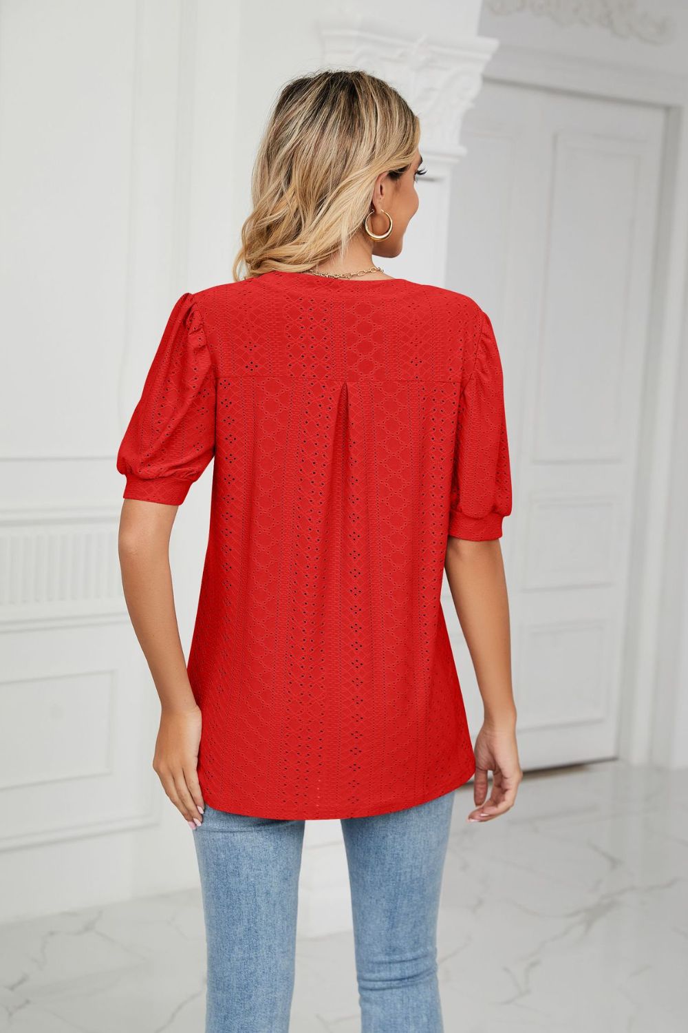 Eyelet puff sleeve top with notched V-neck