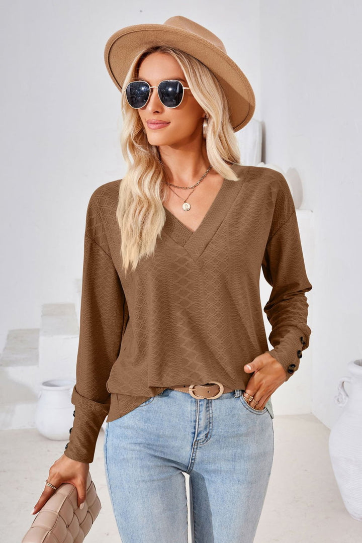 Textured knit V-neck long sleeve top with button cuffs
