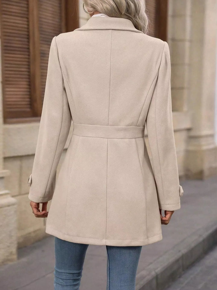 Single-breasted lapel coat with waist tabs and pockets