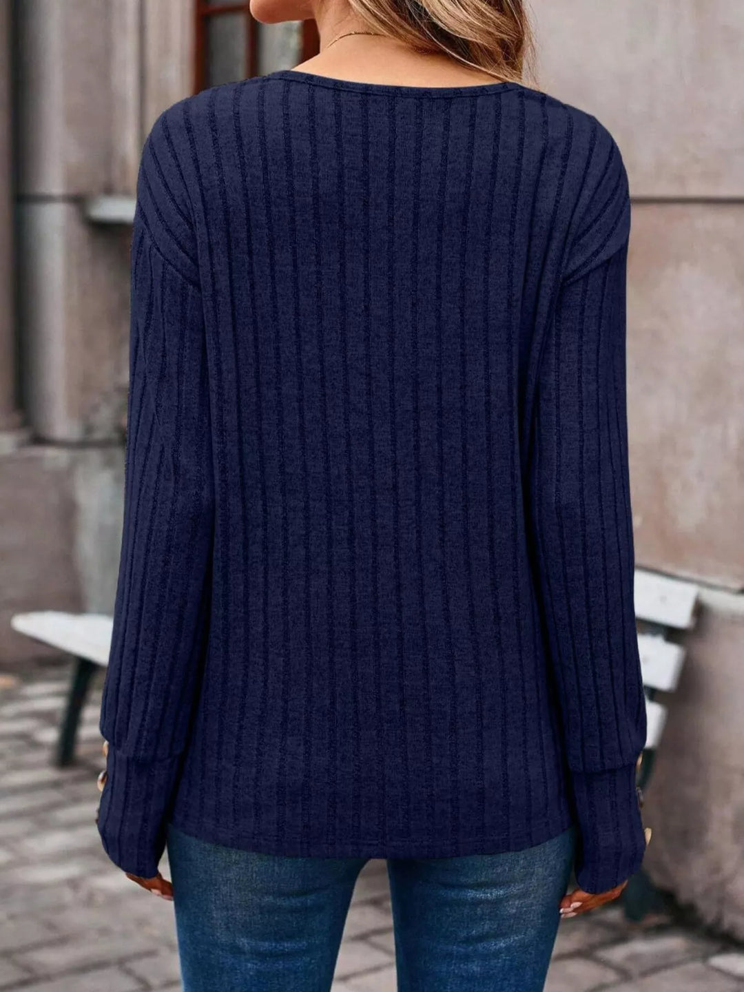 Ribbed knit V-neck top with buttoned cuffs