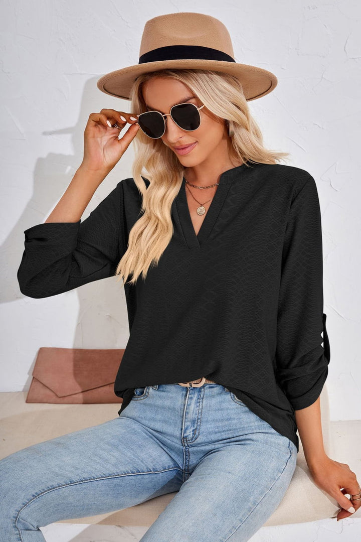 Textured split v-neck blouse with roll-tab sleeves