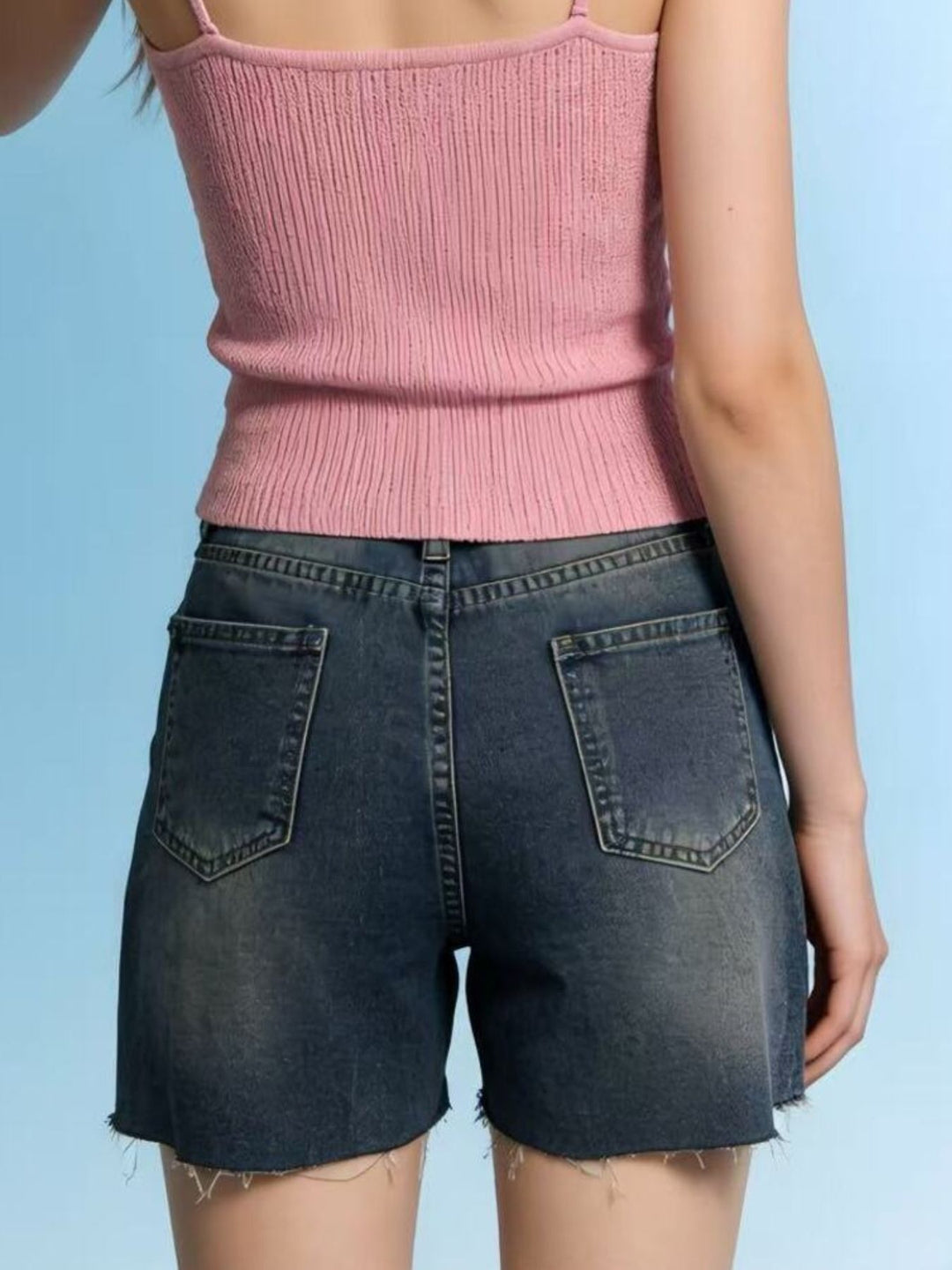 Distressed high-rise denim shorts with frayed raw hem