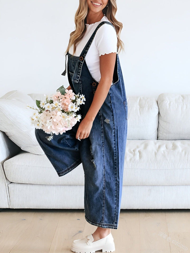 Distressed wide leg denim overalls with adjustable straps
