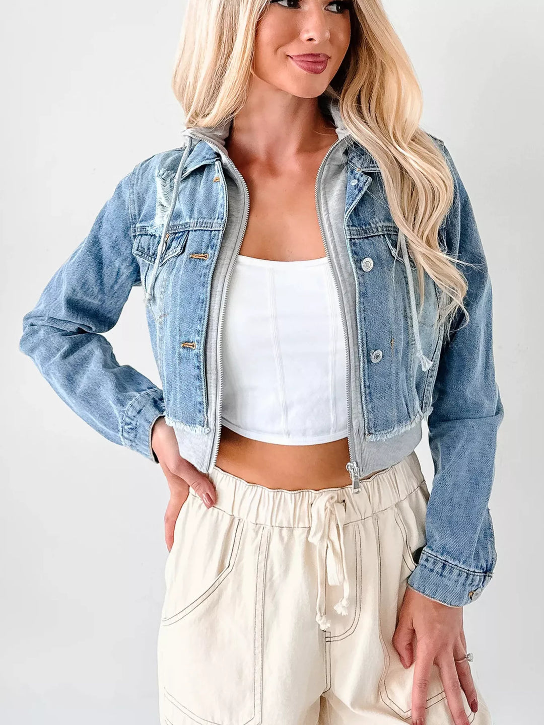 Distressed cropped hooded denim jacket with zip front