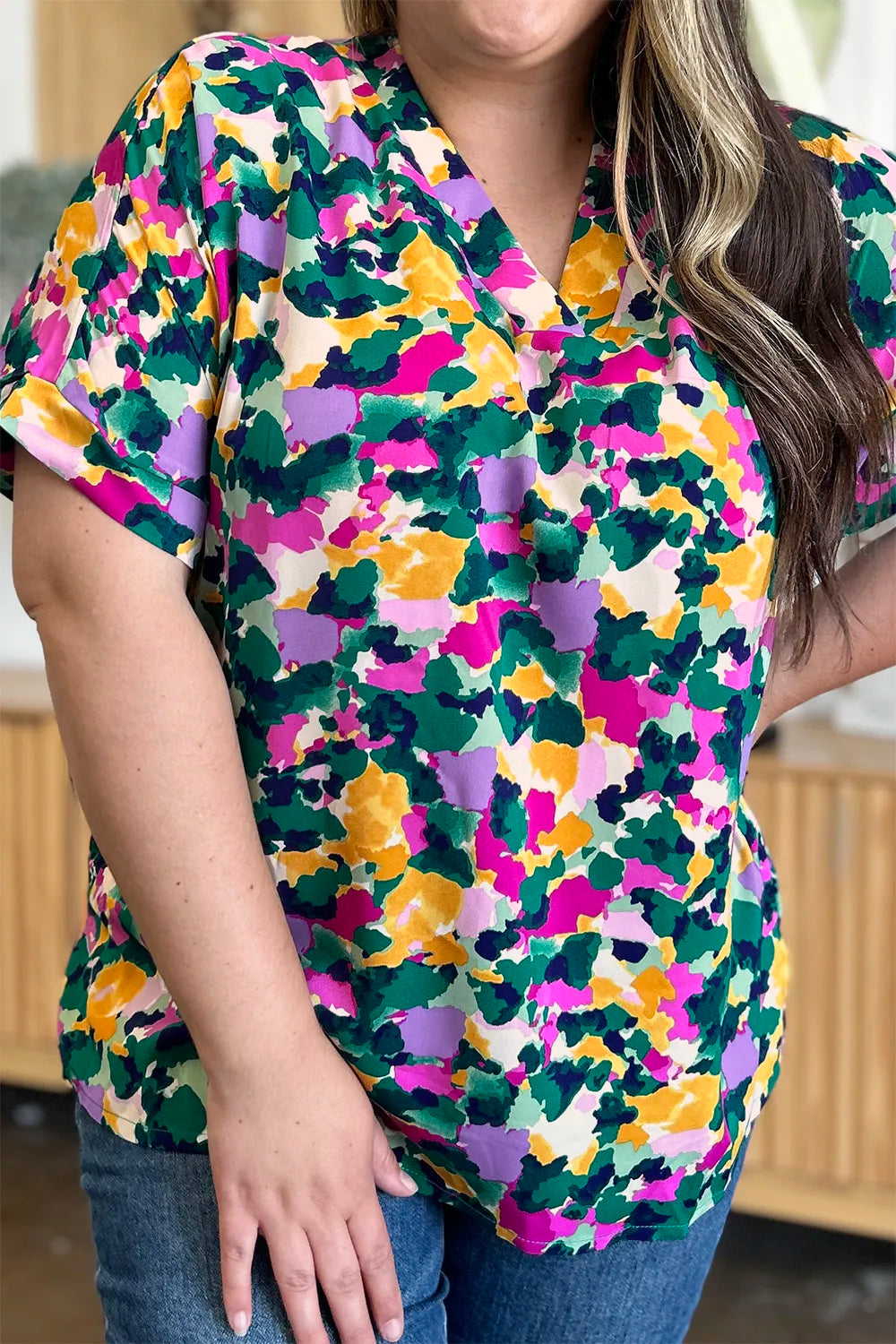 Abstract print v-neck tunic top with flutter sleeves and side slits