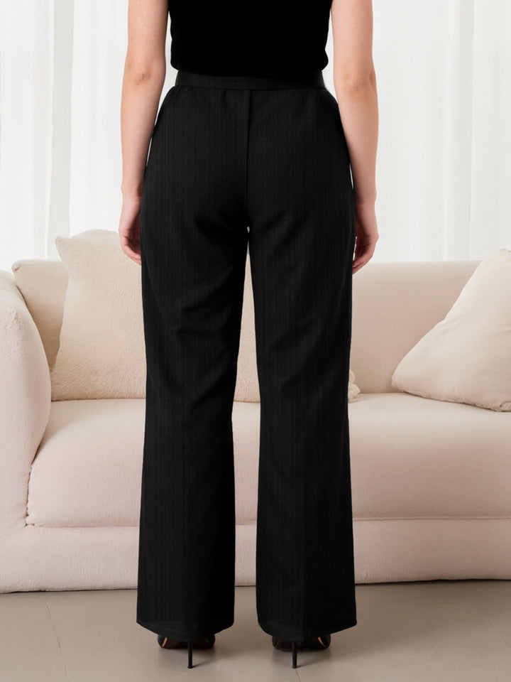 Plus size high-rise wide-leg pants with gold chain waist