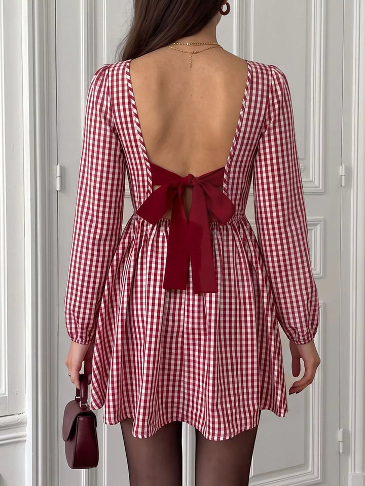 Backless gingham mini dress with bow tie and puff sleeves