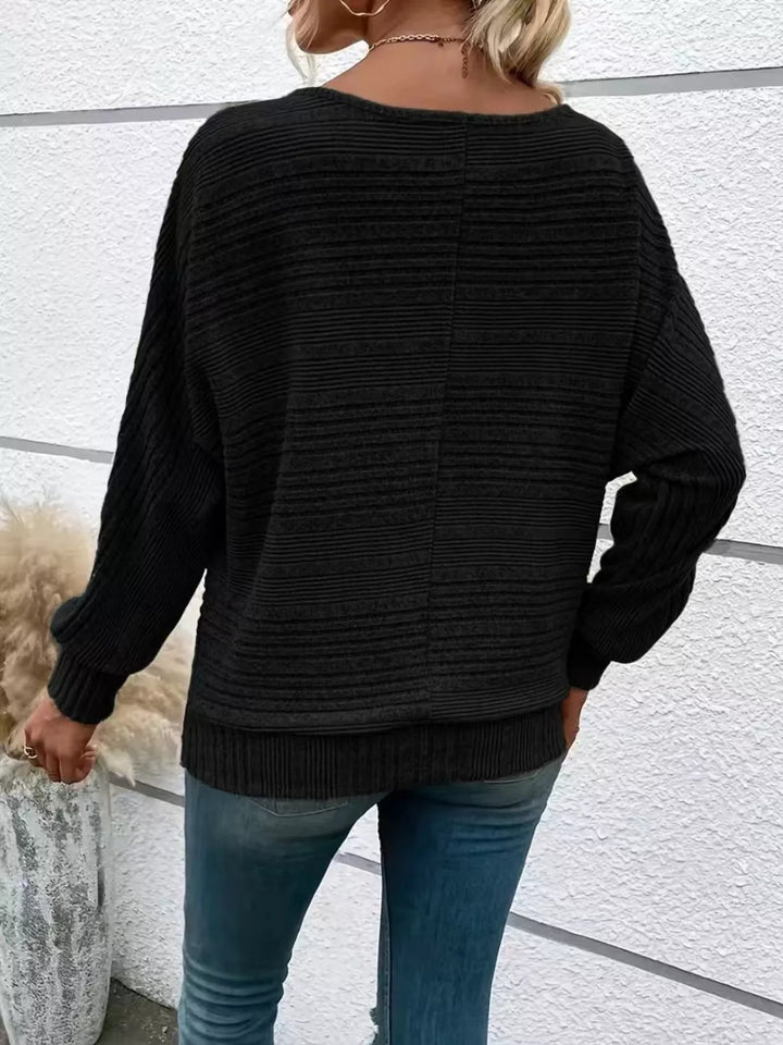 Ribbed knit quarter-zip batwing sweater with O-ring pull
