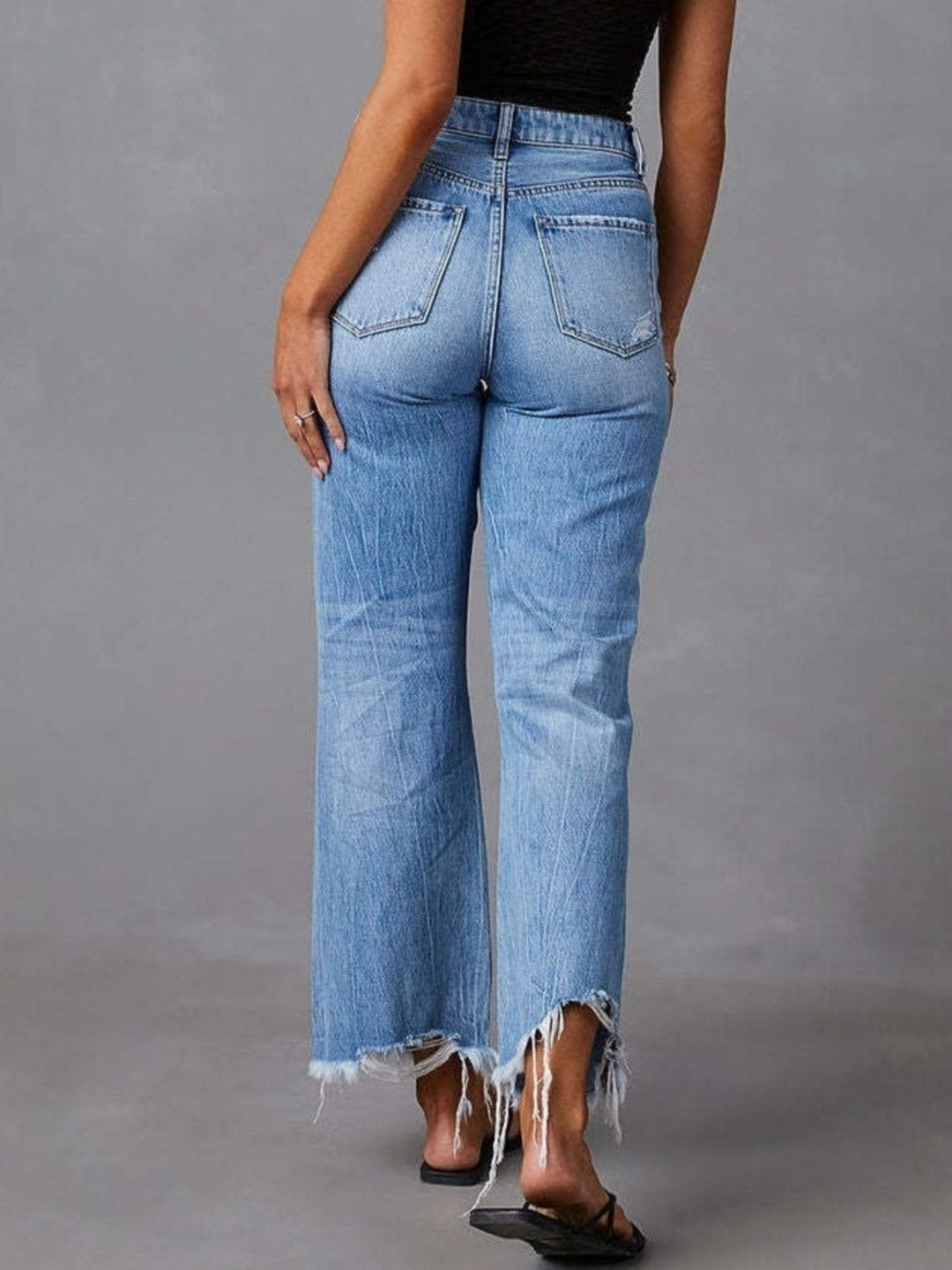 High-rise distressed flare jeans with frayed raw hem