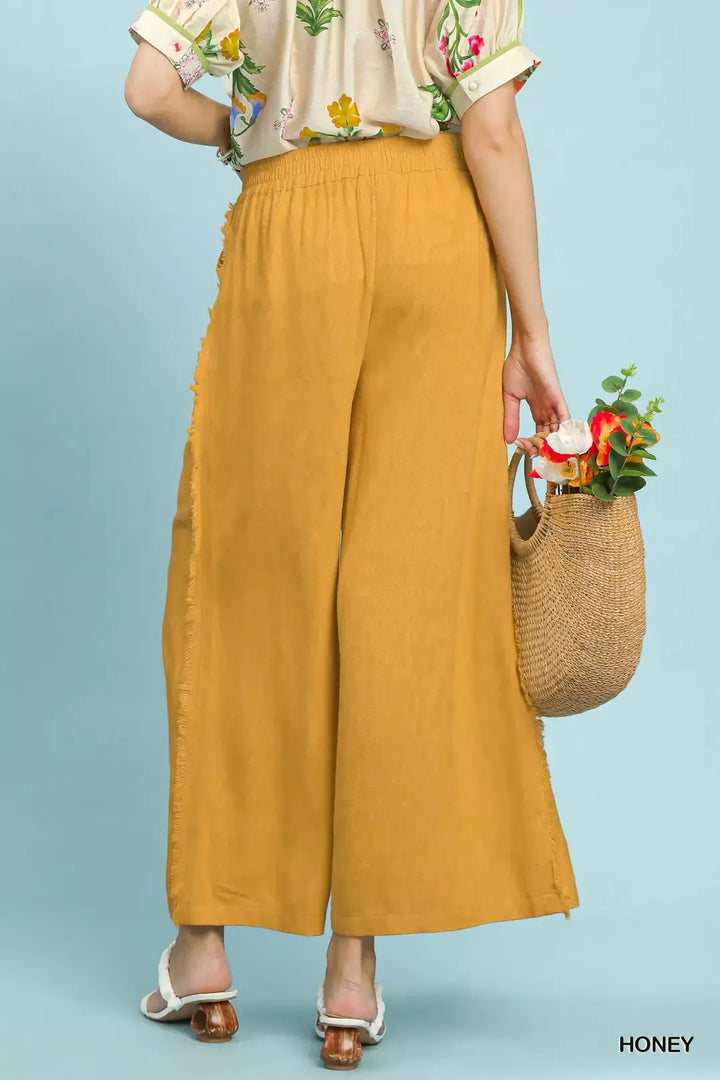 Wide-leg linen blend pants with frayed side trim and patch pockets