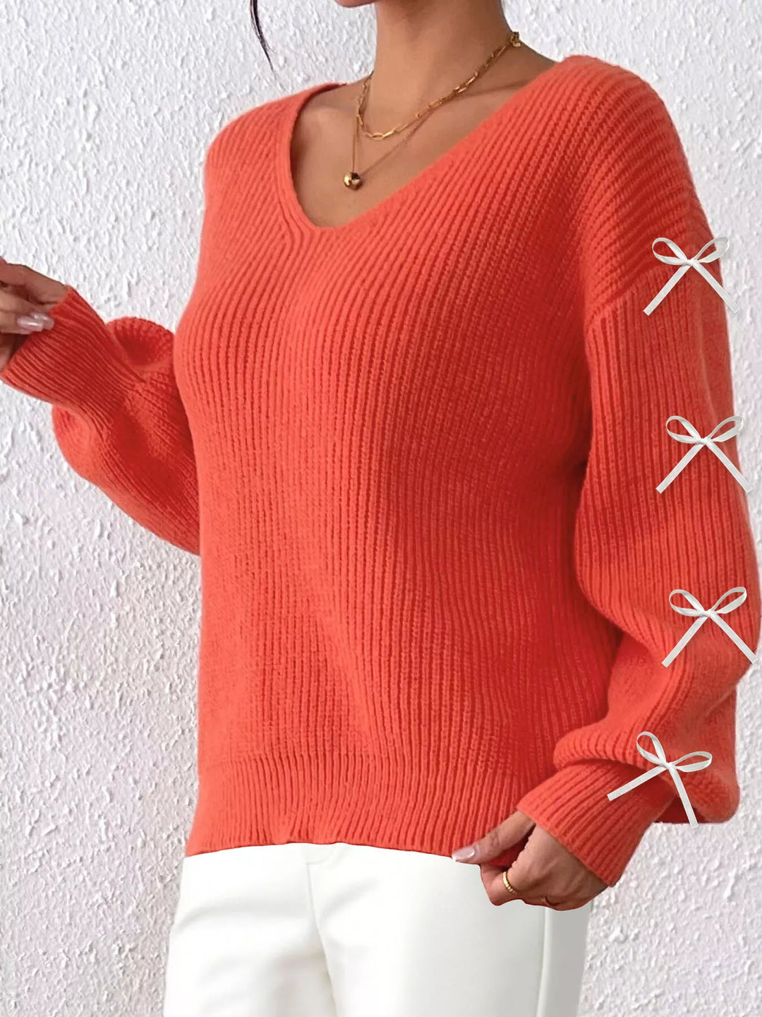 Ribbed knit V-neck sweater with bow-tie sleeves