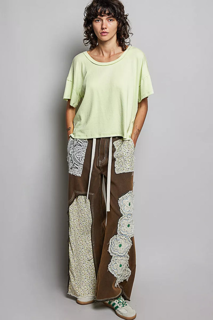 Relaxed short sleeve tee with high-low hem and exposed seams