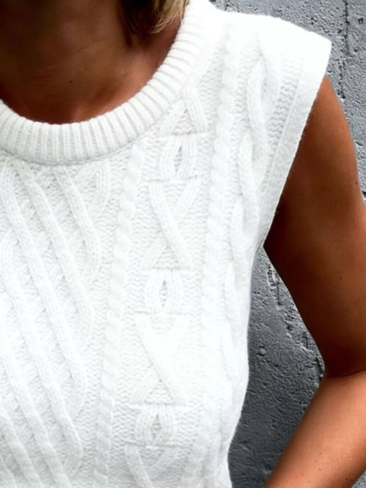 Cable knit sweater vest with ribbed crew neck