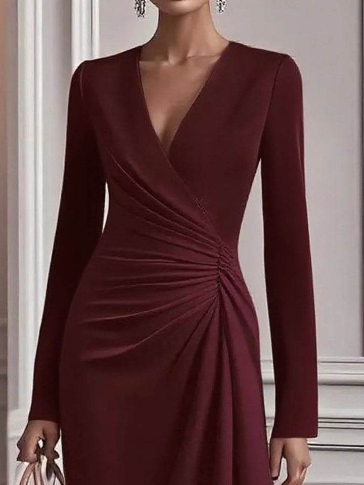 Ruched surplice long sleeve midi dress with asymmetric hem