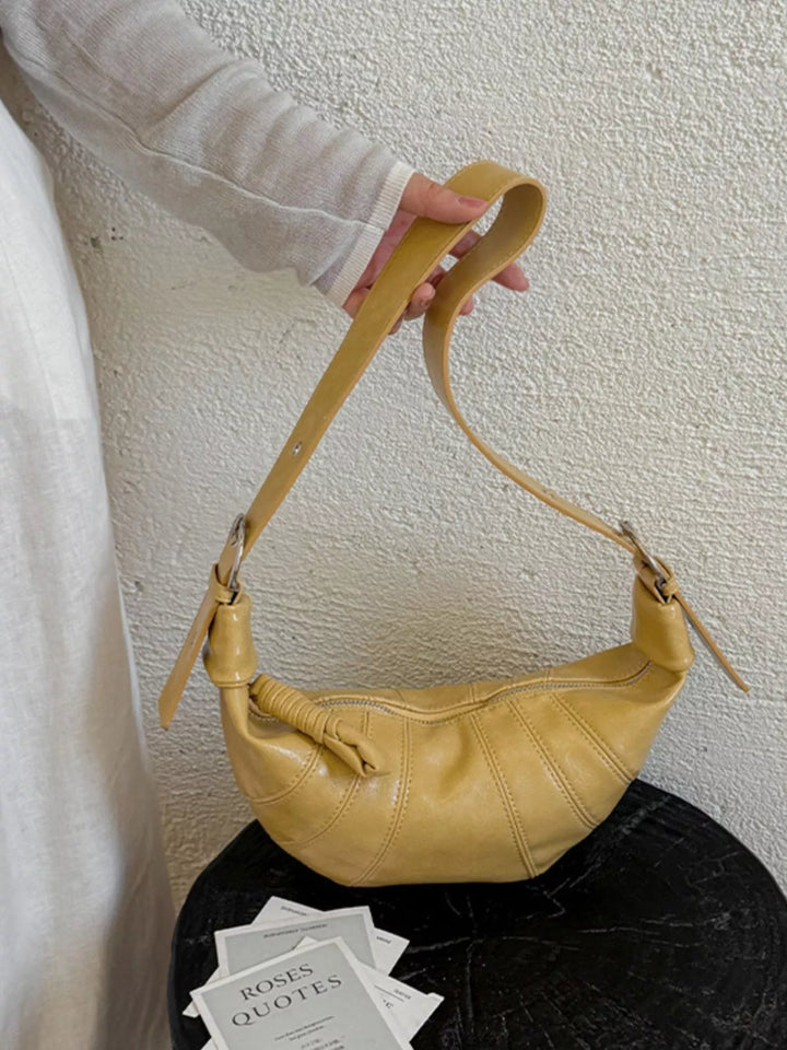 Croissant crossbody bag with adjustable strap and zip top