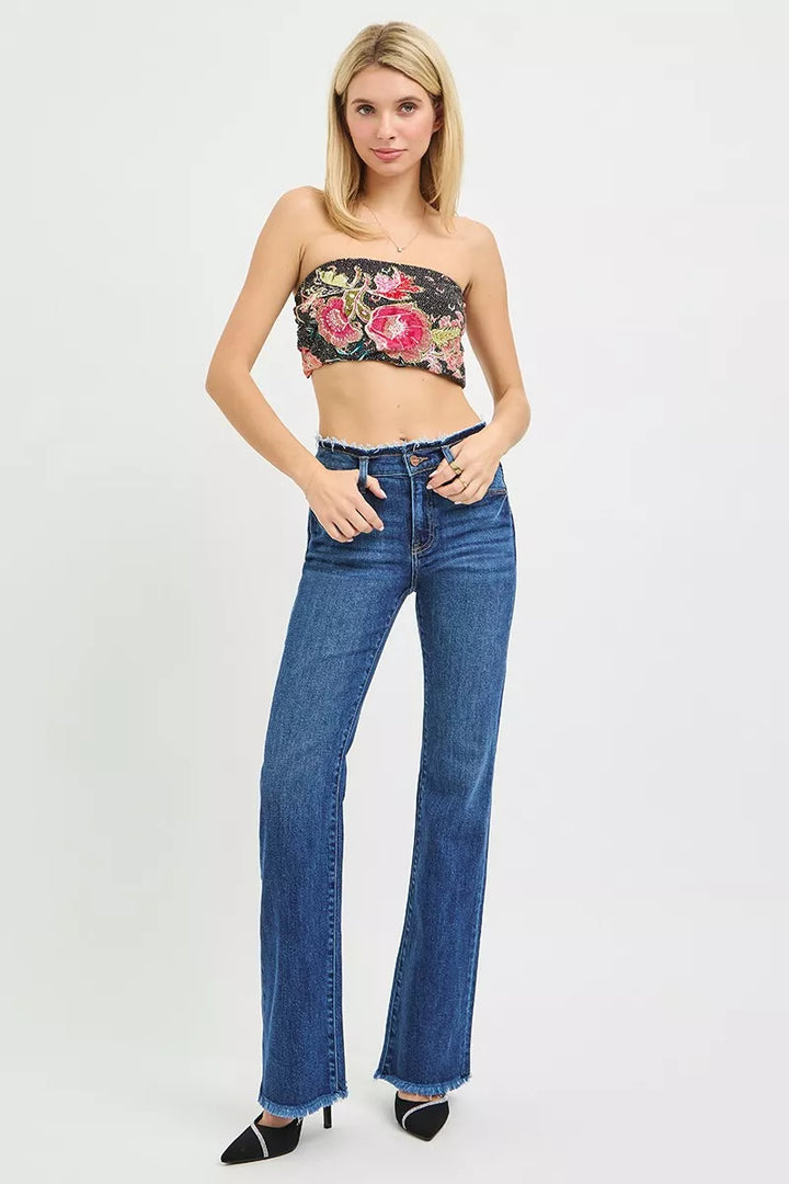 Mid-rise bootcut jeans with frayed waistband and raw hem