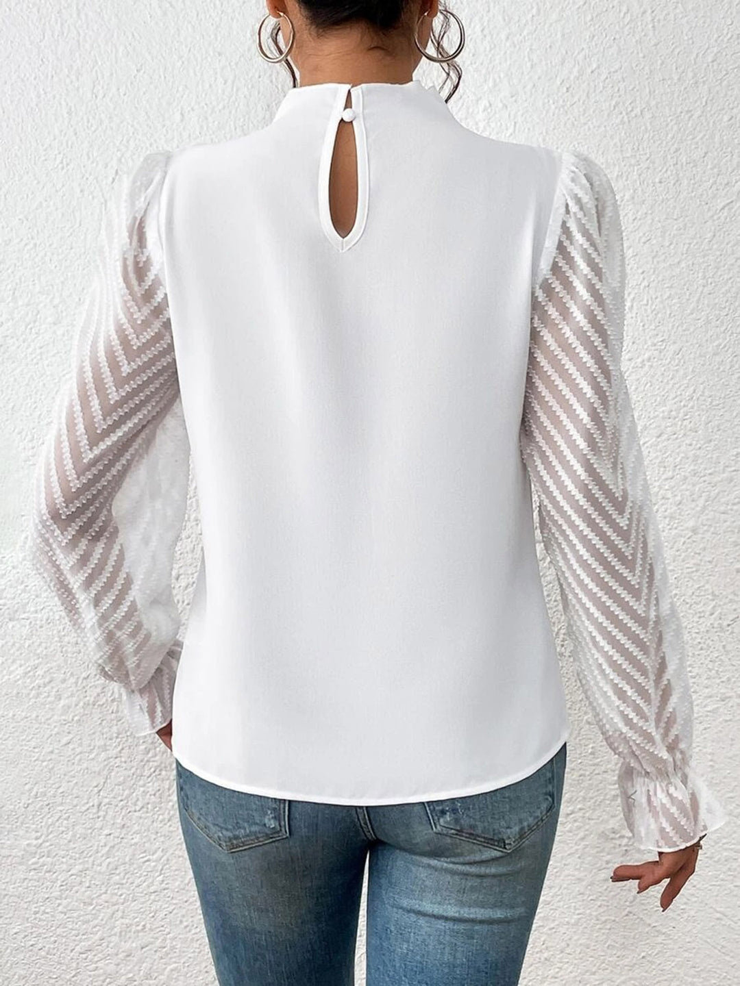 Mock neck blouse with sheer textured flounce sleeves