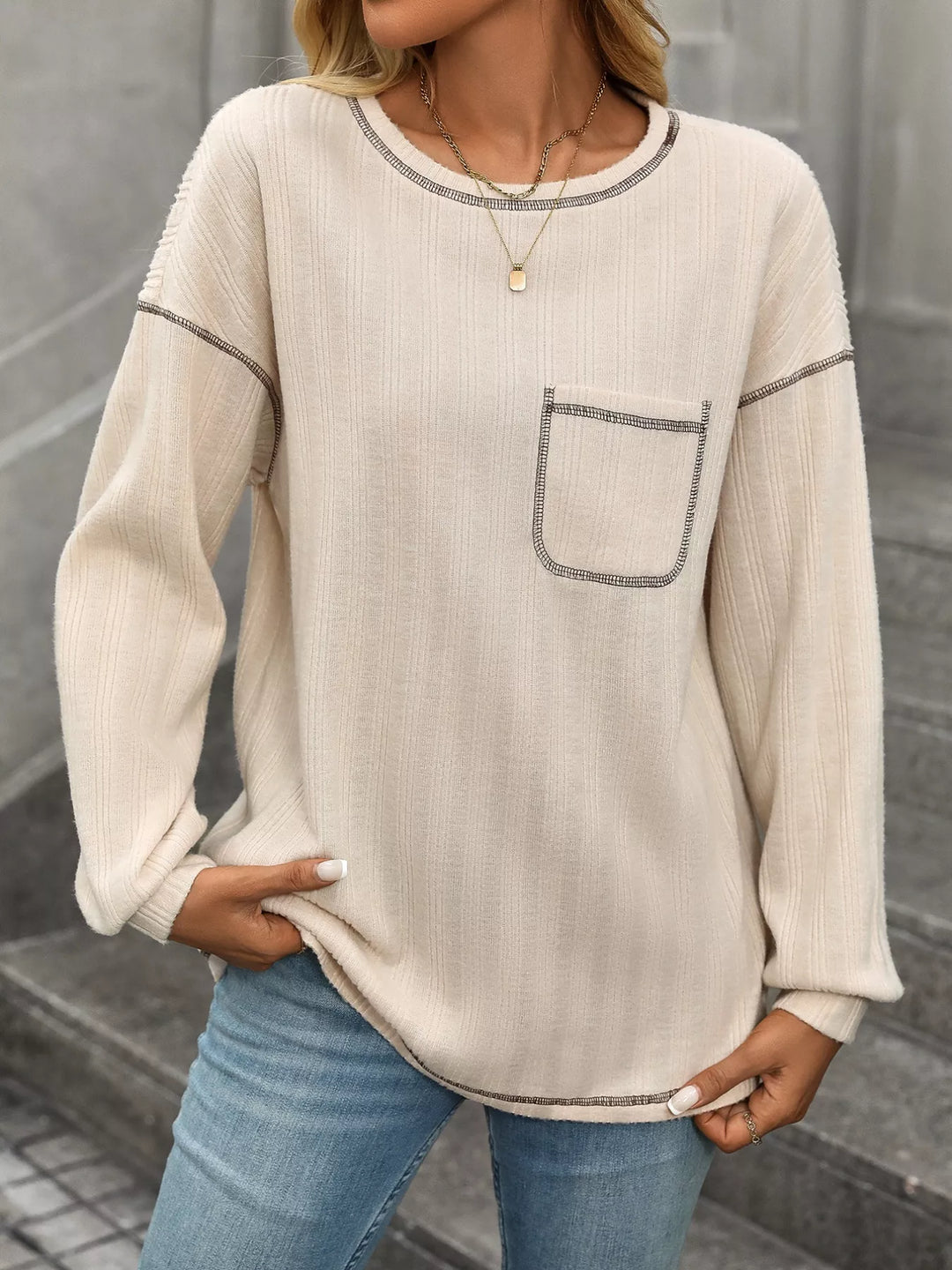 Contrast stitch long sleeve top with patch pocket