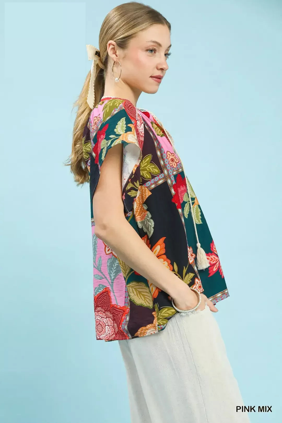 Mixed floral patchwork top with tassel tie neck