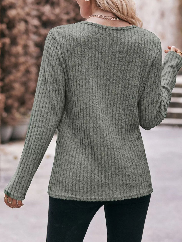 Ribbed knit long sleeve top with side button hem