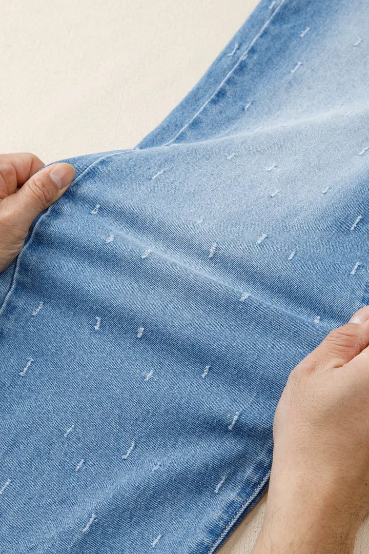 Distressed wide-leg jeans with tummy control and raw hem