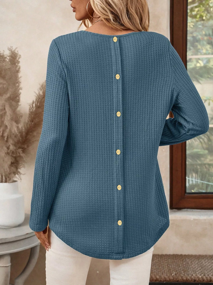 Waffle knit crew neck long sleeve top with curved hem