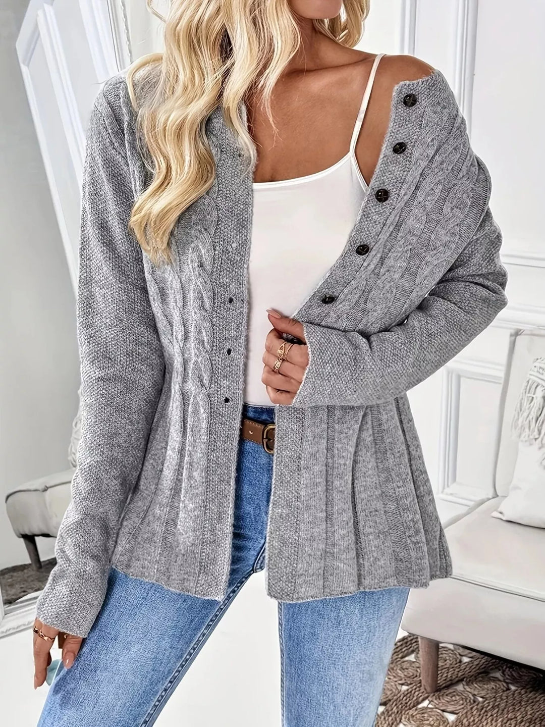 Cable knit button-up cardigan with peplum hem