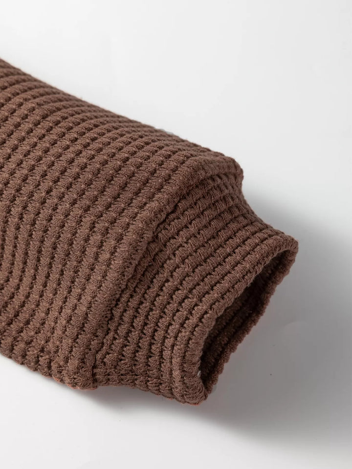 Waffle knit half-button hooded pullover with contrast trim