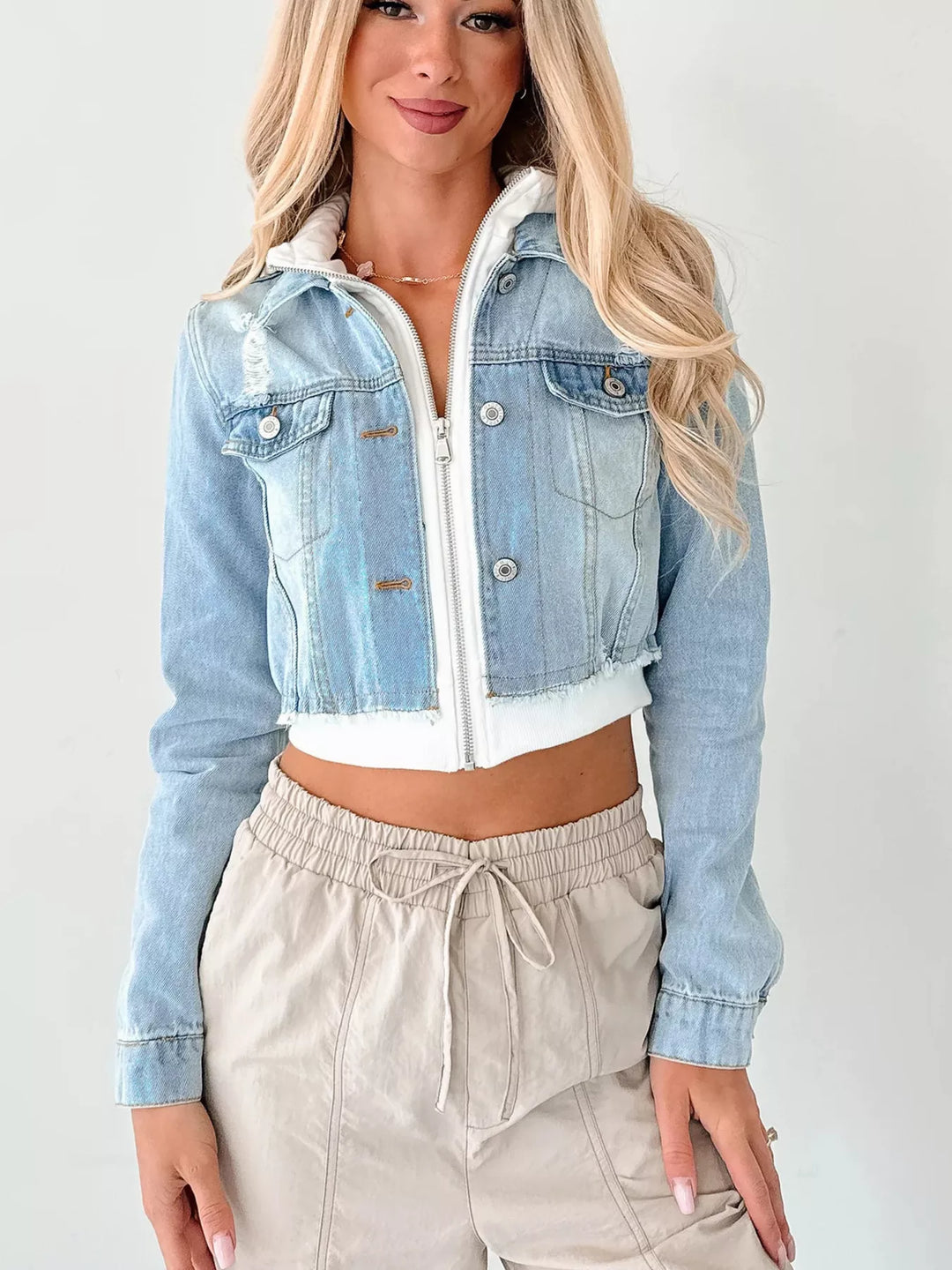 Distressed cropped hooded denim jacket with zip front