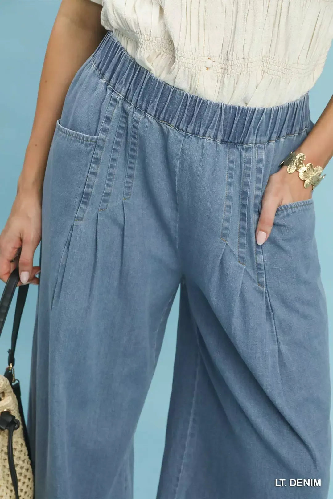 Stone washed wide-leg cotton pants with raw frayed hem