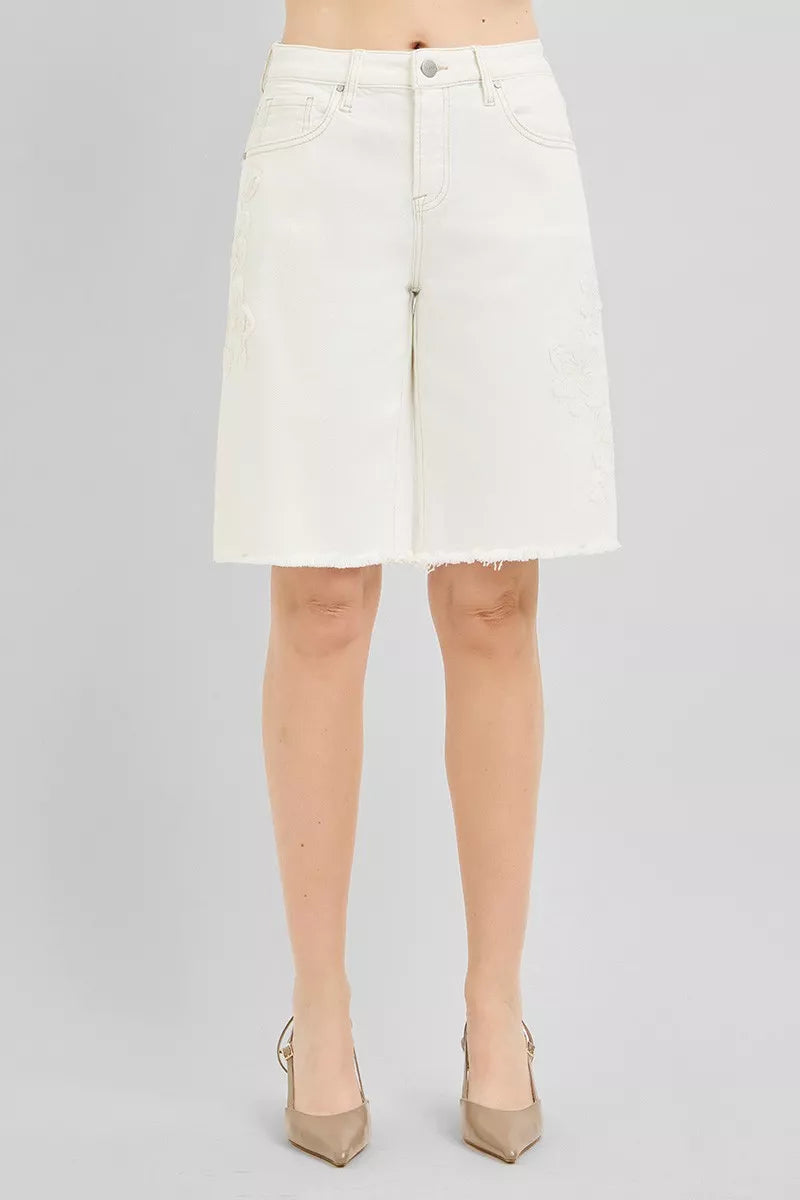 Relaxed Bermuda denim shorts with floral embroidery and raw hem