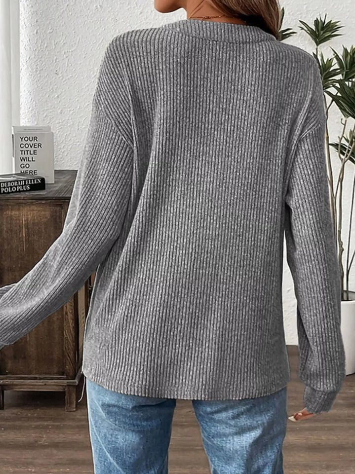 Ribbed knit long sleeve henley top with button placket