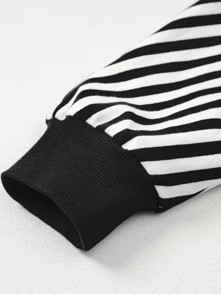 Exposed seam striped drop-shoulder pullover top