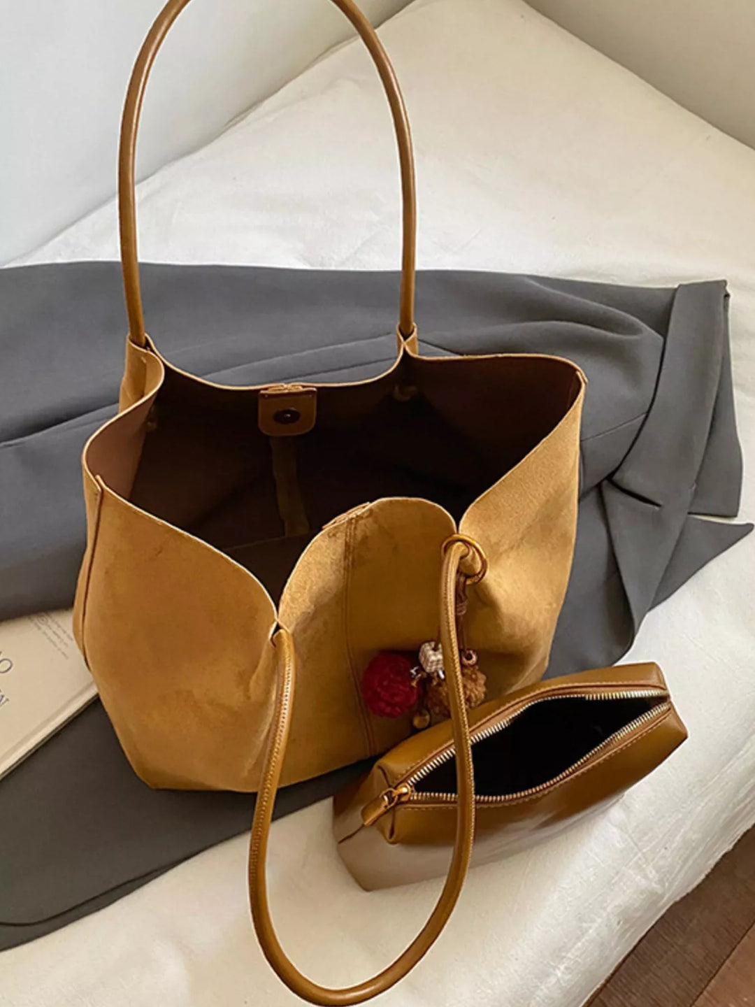 Large slouchy suede shoulder tote bag with pom charm