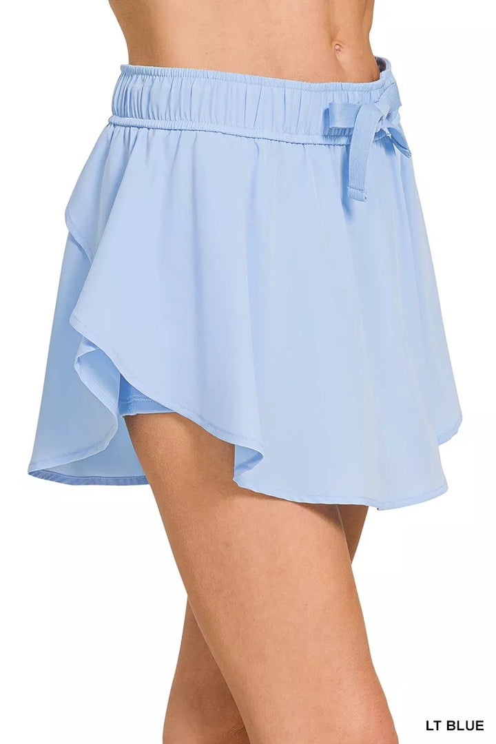 Active woven skort with drawstring waist and pockets