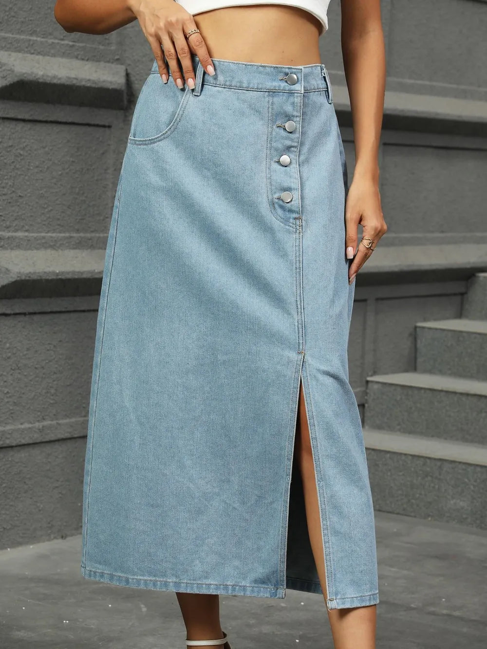 Asymmetrical button-detail denim midi skirt with front slit
