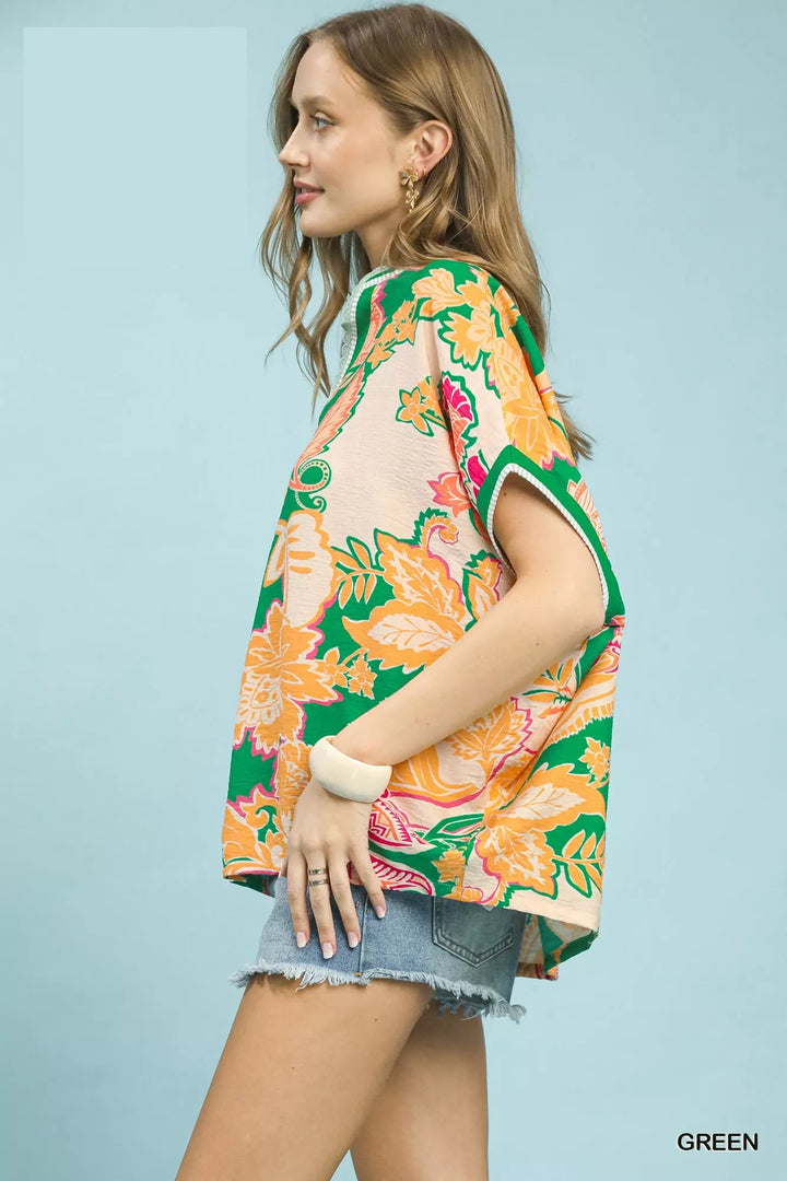Oversized floral print top with V-neck and lace trim