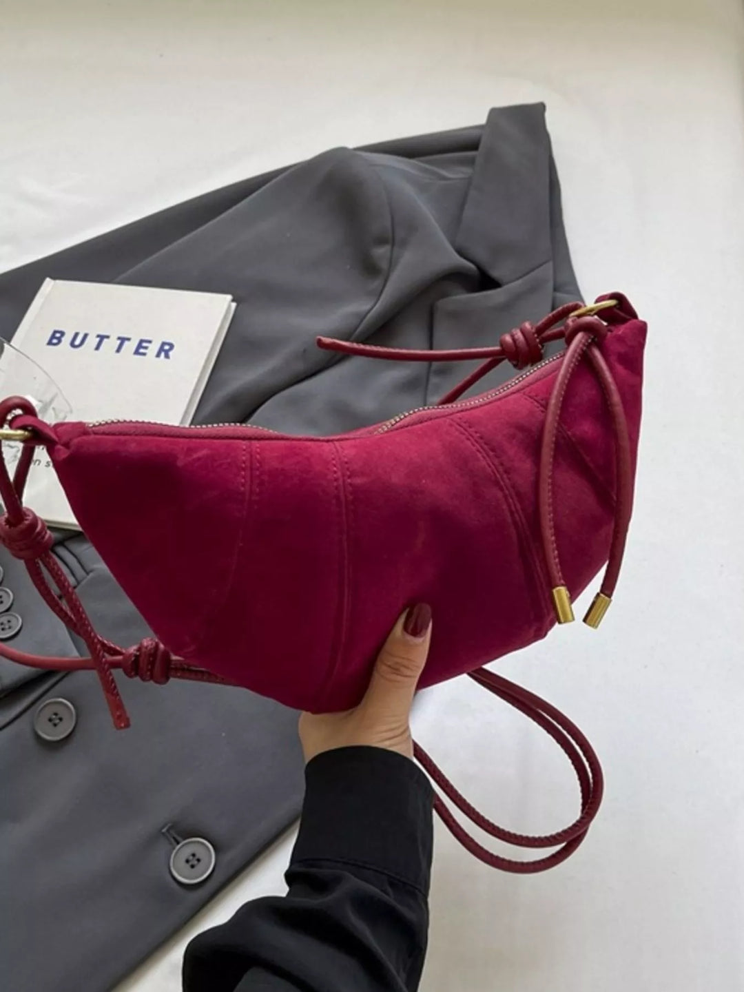 Crescent suede-look crossbody bag with knotted strap