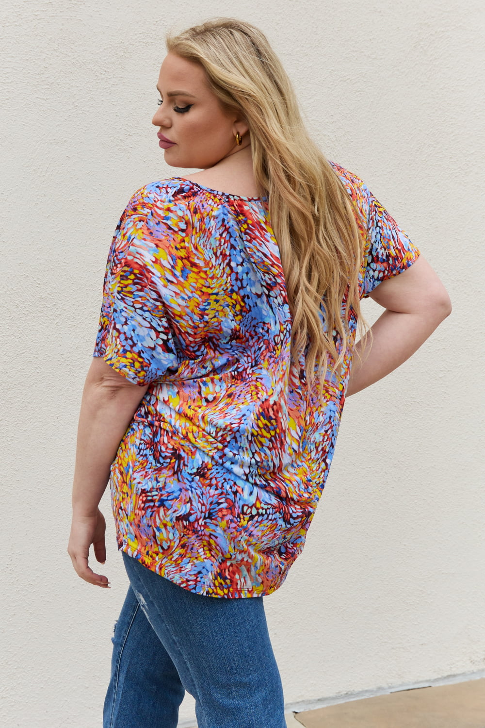 Abstract print dolman sleeve flowy V-neck top