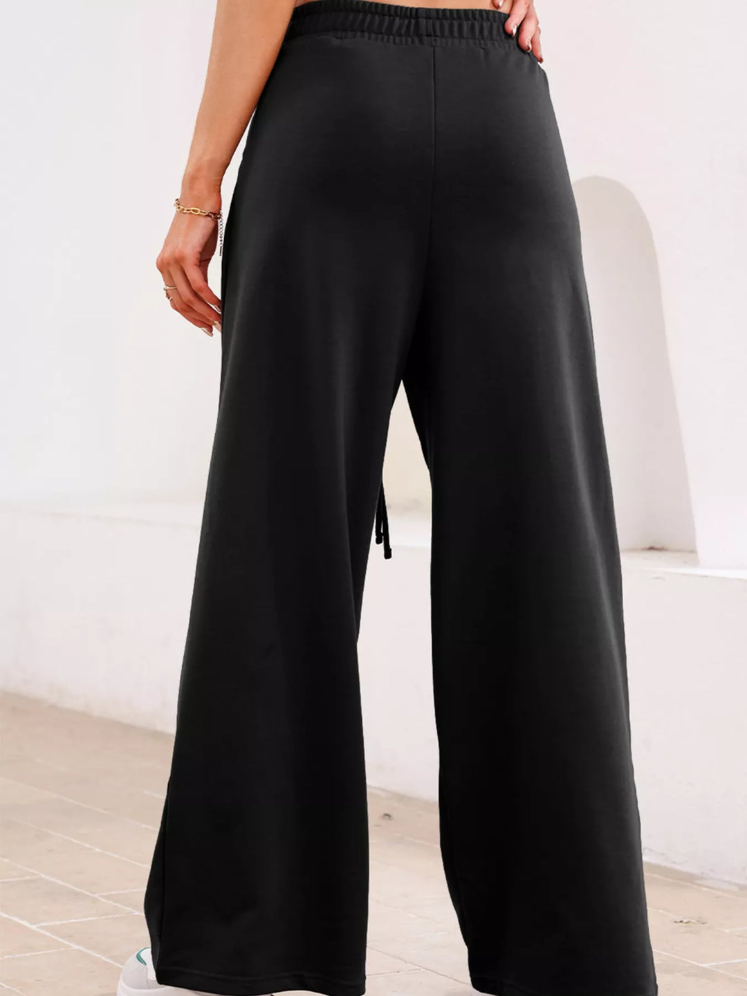 High-rise wide-leg pleated sweatpants with drawstring