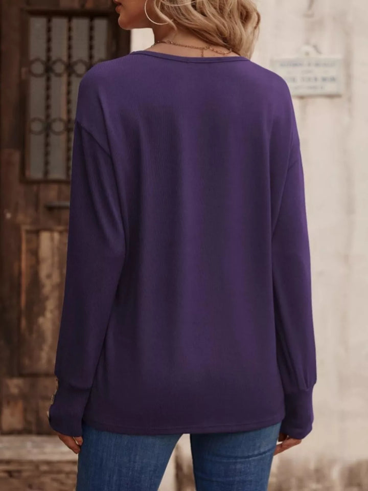 V-neck long sleeve top with button cuffs