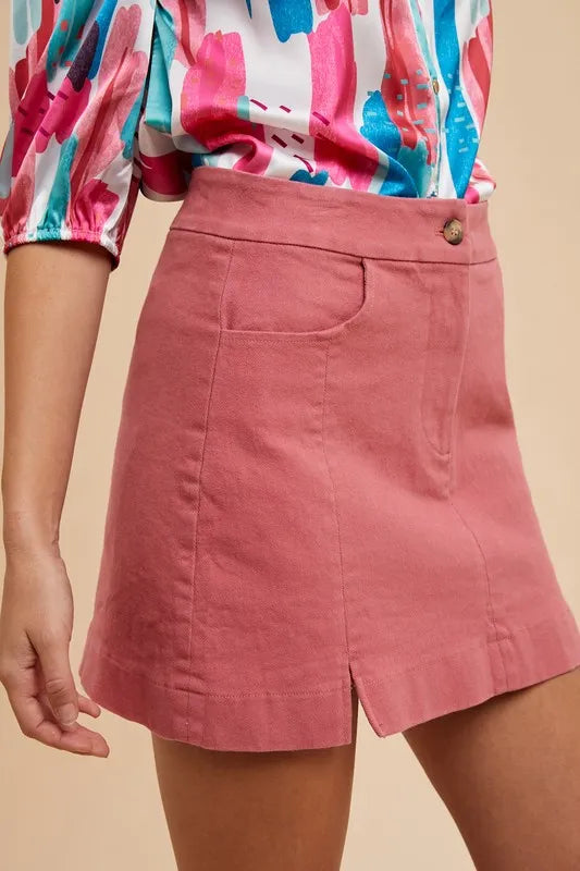 Stretch cotton mini skirt with side slits and front pockets